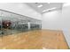 Well-lit racquetball court with glass walls and hardwood floor at 7117 E Rancho Vista Dr # 4005, Scottsdale, AZ 85251