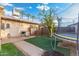 Backyard features a patio, artificial turf, and trampoline at 7214 N 35Th Ave, Phoenix, AZ 85051