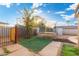 Large backyard with trampoline, artificial turf, and wooden fence at 7214 N 35Th Ave, Phoenix, AZ 85051