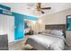 Bedroom with a queen bed, ceiling fan, and mirrored closet at 7214 N 35Th Ave, Phoenix, AZ 85051