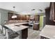 Modern kitchen with dark wood cabinets and a breakfast bar at 7214 N 35Th Ave, Phoenix, AZ 85051