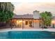 Inviting backyard with a refreshing pool, pergola, and patio at 7301 E Claremont St, Scottsdale, AZ 85250