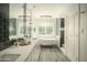 Elegant bathroom featuring a freestanding tub and walk-in shower at 7301 E Claremont St, Scottsdale, AZ 85250