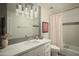 Modern bathroom with marble vanity and updated fixtures at 7301 E Claremont St, Scottsdale, AZ 85250