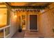 Inviting entryway with a unique wood door and a cactus plant at 7301 E Claremont St, Scottsdale, AZ 85250