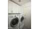 Bright laundry room, featuring washer, dryer, and ample storage at 7301 E Claremont St, Scottsdale, AZ 85250