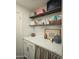 Laundry room features stylish shelving and a quartz countertop at 7301 E Claremont St, Scottsdale, AZ 85250