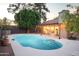 Relaxing kidney-shaped pool in a beautifully landscaped backyard at 7301 E Claremont St, Scottsdale, AZ 85250