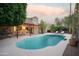 Inviting kidney-shaped pool with pergola and lounge chairs at 7301 E Claremont St, Scottsdale, AZ 85250