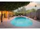 Inviting pool with pergola, string lights, and lounge chairs at 7301 E Claremont St, Scottsdale, AZ 85250