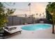 Relaxing pool area with lounge chairs and string lights at 7301 E Claremont St, Scottsdale, AZ 85250