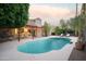 Relaxing kidney shaped pool with patio and pergola at 7301 E Claremont St, Scottsdale, AZ 85250