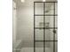 Elegant walk-in shower with a built-in bench and glass enclosure at 7301 E Claremont St, Scottsdale, AZ 85250