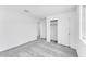 Bedroom showcasing neutral carpet, white walls, and a closet with sliding doors at 7820 E Quintana Ave, Mesa, AZ 85212