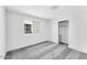 Bedroom with neutral carpeting, a closet with white doors and one window at 7820 E Quintana Ave, Mesa, AZ 85212