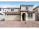 Charming two-story home featuring a tile roof, neutral stucco exterior, and an attached two-car garage at 7820 E Quintana Ave, Mesa, AZ 85212