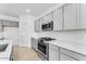 Well-equipped kitchen with stainless steel appliances, gray cabinets, and a white subway tile backsplash at 7820 E Quintana Ave, Mesa, AZ 85212