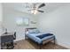 Bright bedroom with a double bed, desk, and ceiling fan at 899 E Flint St, Chandler, AZ 85225