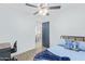 Bedroom with a full bed, ceiling fan, and a view into the kitchen area at 899 E Flint St, Chandler, AZ 85225