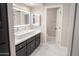 Modern bathroom with double vanity and large mirror at 9025 N 86Th Pl, Scottsdale, AZ 85258