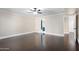 Bedroom with dark hardwood floors, ceiling fan and bathroom access at 9025 N 86Th Pl, Scottsdale, AZ 85258