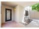 Front door entry with brick walkway and wrought iron door at 9025 N 86Th Pl, Scottsdale, AZ 85258