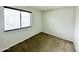 Simple bedroom with window, neutral walls and carpeting at 9054 N 51St Ln, Glendale, AZ 85302