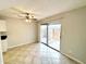 Dining area with tile floors, sliding glass door to patio, and ceiling fan at 9054 N 51St Ln, Glendale, AZ 85302