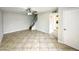 Spacious living room featuring tile floors and a view of the staircase at 9054 N 51St Ln, Glendale, AZ 85302