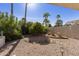 Landscaped backyard with gravel, plants, and rock features at 9637 E Sundune Dr, Sun Lakes, AZ 85248