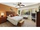 Charming bedroom with a queen-size bed and backyard views at 9637 E Sundune Dr, Sun Lakes, AZ 85248