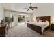 Spacious bedroom with king-size bed and backyard access at 9637 E Sundune Dr, Sun Lakes, AZ 85248