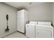 Laundry room with washer, dryer, and white cabinets at 9637 E Sundune Dr, Sun Lakes, AZ 85248