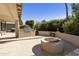 Outdoor kitchen with built-in grill and fire pit at 9637 E Sundune Dr, Sun Lakes, AZ 85248