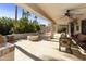 Spacious patio with fire pit and seating area at 9637 E Sundune Dr, Sun Lakes, AZ 85248