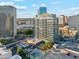 High rise building with pool and surrounding cityscape at 1 E Lexington Ave # 701, Phoenix, AZ 85012