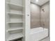 Bathroom with large bathtub and built-in shelving at 1 E Lexington Ave # 701, Phoenix, AZ 85012