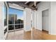 Modern bedroom featuring hardwood floors and large windows at 1 E Lexington Ave # 701, Phoenix, AZ 85012