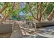 Landscaped courtyard with walkways and mature trees at 1 E Lexington Ave # 701, Phoenix, AZ 85012