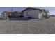 View of home's back, showing covered patio and gravel yard at 10178 W San Lazaro Dr, Arizona City, AZ 85123