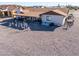 View of home's back, showing covered patio and gravel yard at 10178 W San Lazaro Dr, Arizona City, AZ 85123