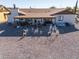 Covered patio with hot tub and decorative yard art at 10178 W San Lazaro Dr, Arizona City, AZ 85123