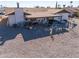 Covered patio with hot tub and decorative yard art at 10178 W San Lazaro Dr, Arizona City, AZ 85123