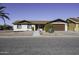 Single story home with brown garage door and landscaped yard at 10178 W San Lazaro Dr, Arizona City, AZ 85123