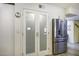 Stainless steel refrigerator and pantry with frosted glass doors at 10178 W San Lazaro Dr, Arizona City, AZ 85123