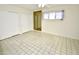 Bedroom with tiled floors, neutral walls, and a ceiling fan at 102 W Maryland Ave # B2, Phoenix, AZ 85013