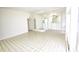 Bright living and dining area with tiled floors and a large mirror at 102 W Maryland Ave # B2, Phoenix, AZ 85013