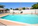 Community swimming pool with plenty of lounge chairs at 102 W Maryland Ave # B2, Phoenix, AZ 85013