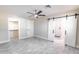 Spacious bedroom with sliding barn doors to en-suite bathroom at 11252 N 37Th St, Phoenix, AZ 85028