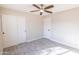 Spacious bedroom with ceiling fan and sliding closet doors at 11252 N 37Th St, Phoenix, AZ 85028